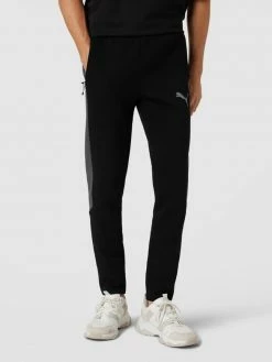 PUMA PERFORMANCE Sweatpants Mit Reißverschlusstaschen Modell 'Evostripe Pants' - Schwarz -BE EDGY Shop 6p9j8l9o9opkelai6l938diiaop42c2j88o5ckq98t3jigigad54qjqb718kqe9m9cql8jq76p0kqka4a8o62pj3ccq38dj564smaohk74q36e1g68s3ccj468s3ior471hjgc0