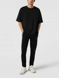 PUMA PERFORMANCE Sweatpants Mit Reißverschlusstaschen Modell 'Evostripe Pants' - Schwarz